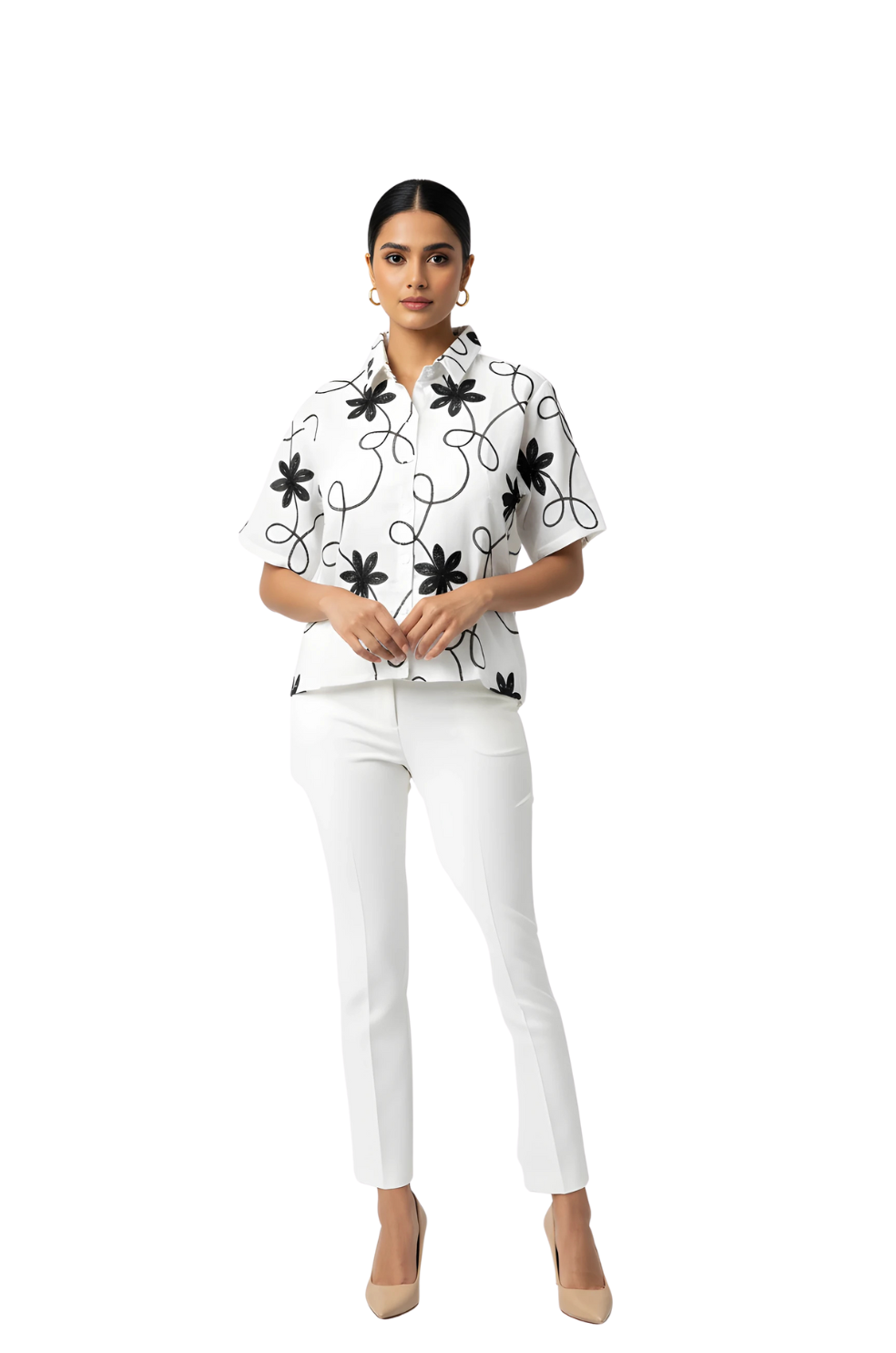 woman wearing white shirt with black floral embroidery from Hava Fashions