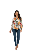 woman wearing geo printed crepe fabric top with multicolor abstract design from Hava Fashions