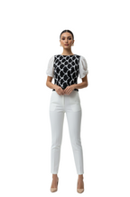 woman wearing puff sleeve white and black top from Hava Fashions