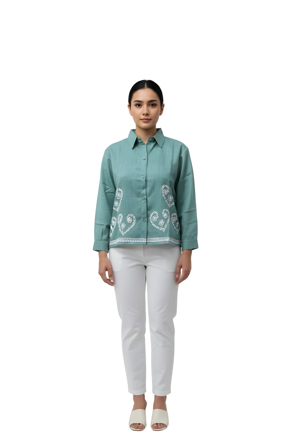 woman wearing seafoam green embroidered shirt with white detailing from Hava Fashions