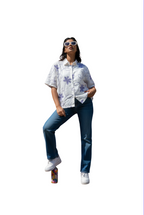 woman wearing purple floral embroidered top from Hava Fashions