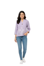 woman wearing white cotton embroidered purple shirt from Hava Fashions