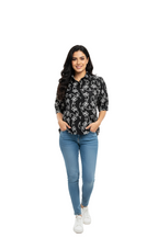 woman wearing black cotton top with white hand embroidery from Hava Fashions