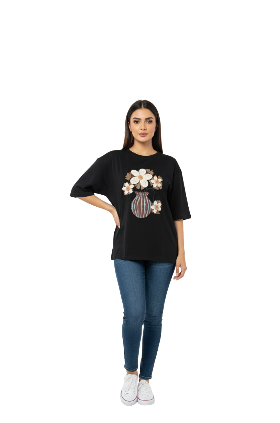 Woman wearing a black t-shirt with a floral design on a white background